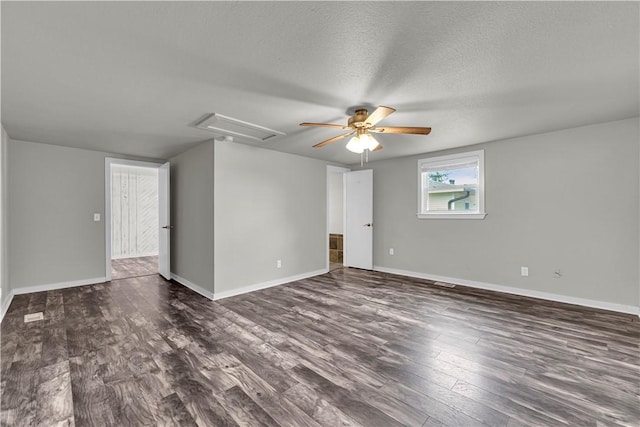 1603 W Poplar St, Rogers, AR 72758 - unfurnished room with dark wood finished floors, ceiling fan, attic access, and a textured ceiling
