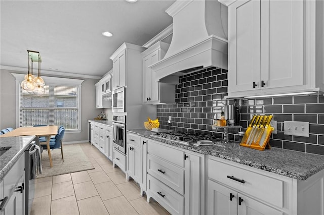 801 Bellmara Cir, Cave Springs, AR 72718 - kitchen with custom range hood, white cabinetry, crown molding, stainless steel appliances, and light tile patterned flooring