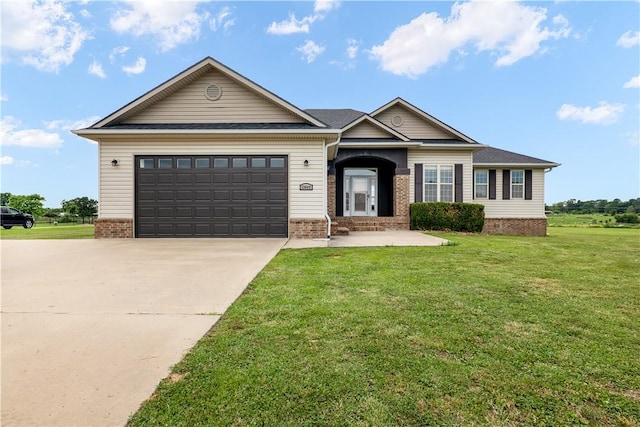 13449 Loyle Ln, Gravette, AR 72736 - view of front of house with concrete driveway, brick siding, a front yard, and an attached garage