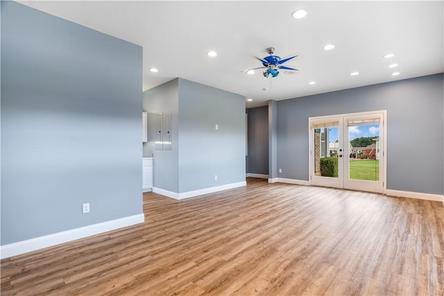 13449 Loyle Ln, Gravette, AR 72736 - empty room featuring recessed lighting, light wood-type flooring, ceiling fan, and french doors