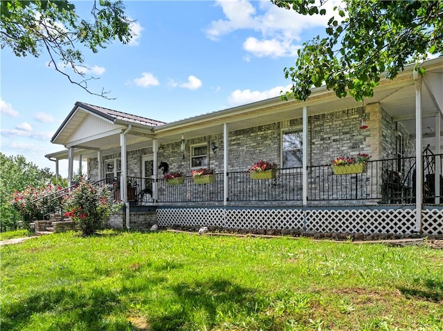 617 County Road 736, Berryville, AR 72616 - view of front facade with covered porch, a front lawn, and stone siding