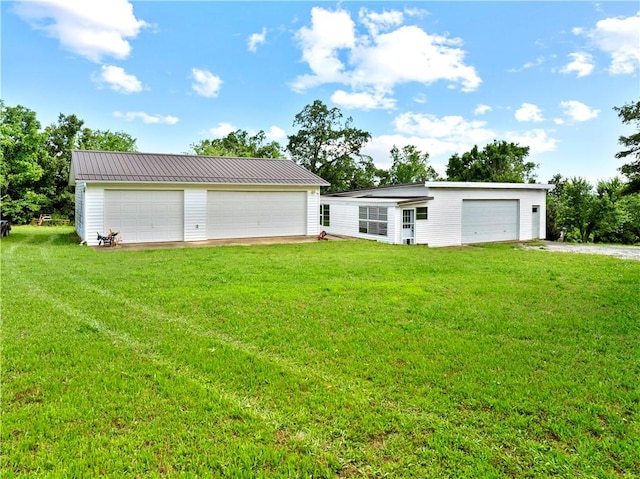 617 County Road 736, Berryville, AR 72616 - view of front facade featuring a detached garage and a front lawn