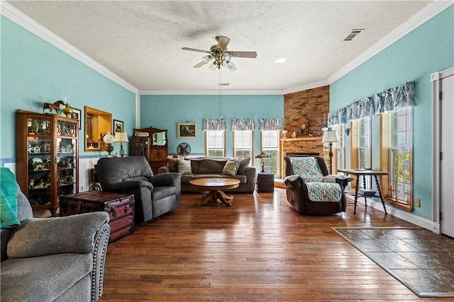 617 County Road 736, Berryville, AR 72616 - living room with hardwood / wood-style floors, ceiling fan, ornamental molding, and a textured ceiling