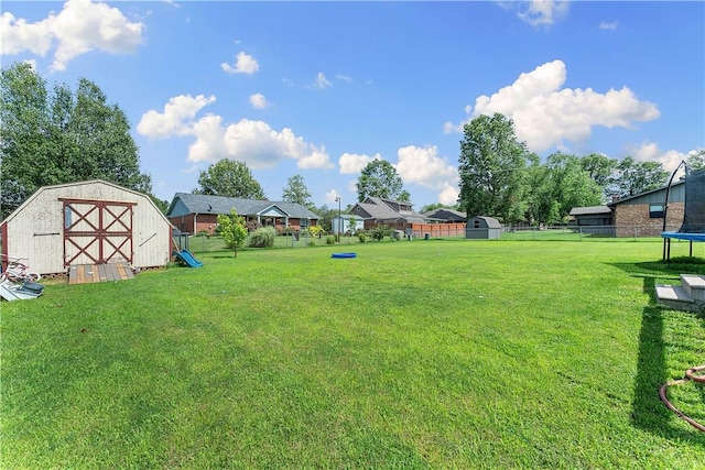 1903 Jean St, Springdale, AR 72762 - view of yard with a trampoline and a storage unit