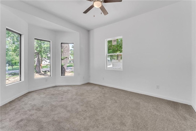 408 SW 2nd Ave, Gravette, AR 72736 - carpeted empty room featuring a ceiling fan and baseboards