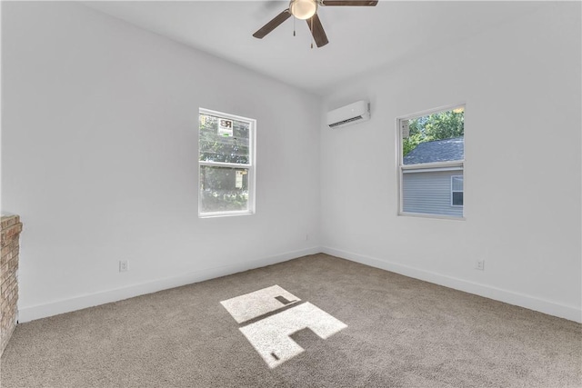 408 SW 2nd Ave, Gravette, AR 72736 - carpeted spare room featuring a wall mounted AC, plenty of natural light, and ceiling fan