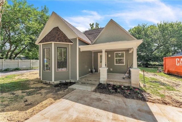 408 SW 2nd Ave, Gravette, AR 72736 - view of front facade featuring roof with shingles and covered porch