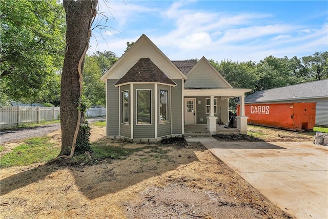408 SW 2nd Ave, Gravette, AR 72736 - view of front of house featuring a porch and roof with shingles