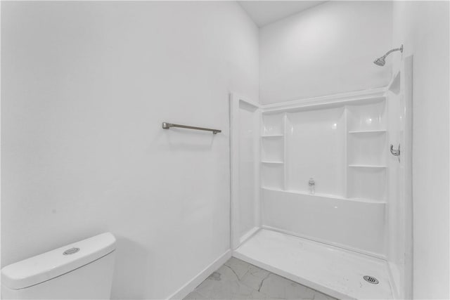 408 SW 2nd Ave, Gravette, AR 72736 - bathroom with marble finish flooring and a shower