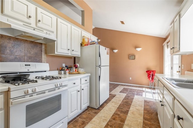 2523 Meadow Lake St, Springdale, AR 72764 - kitchen featuring white appliances, under cabinet range hood, decorative backsplash, white cabinets, and light countertops