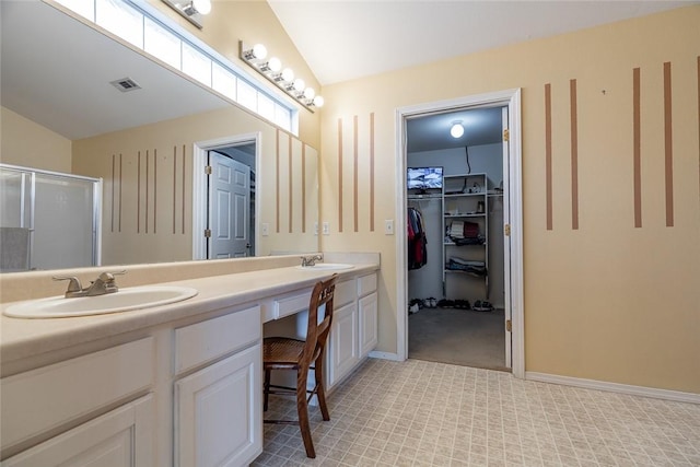 2523 Meadow Lake St, Springdale, AR 72764 - bathroom featuring double vanity, a stall shower, and a walk in closet