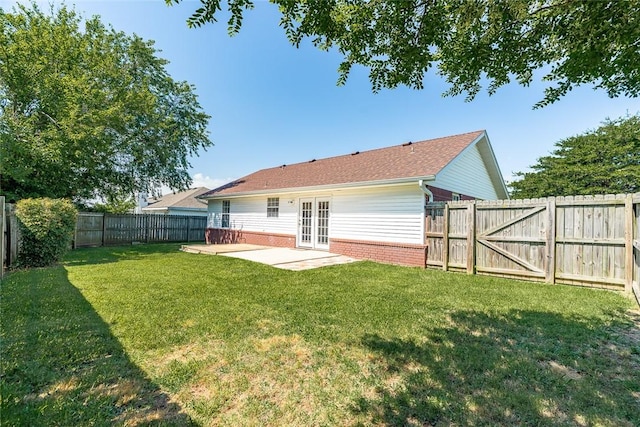2523 Meadow Lake St, Springdale, AR 72764 - rear view of house with french doors, a patio area, brick siding, a fenced backyard, and a gate