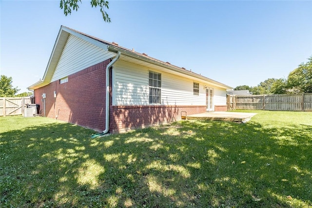 2523 Meadow Lake St, Springdale, AR 72764 - back of property with brick siding, a fenced backyard, and a patio area