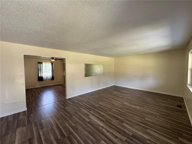 811 Overlook Dr, Mountain Home, AR 72653 - spare room featuring a textured ceiling, dark wood-style floors, and a ceiling fan