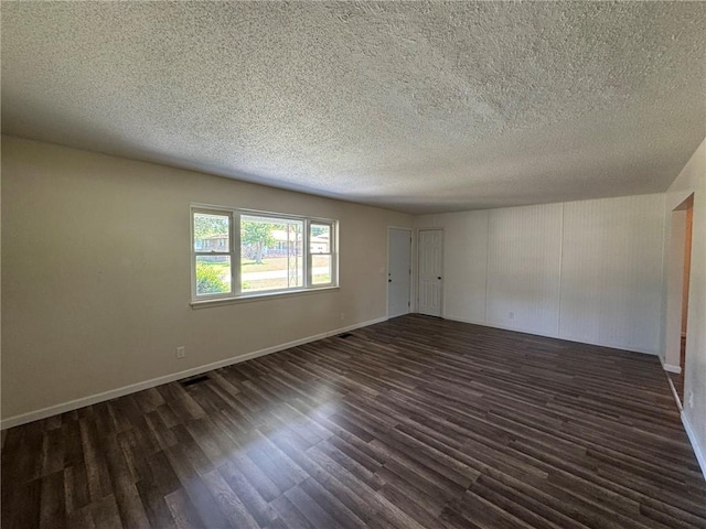 811 Overlook Dr, Mountain Home, AR 72653 - empty room featuring dark wood-style flooring and a textured ceiling