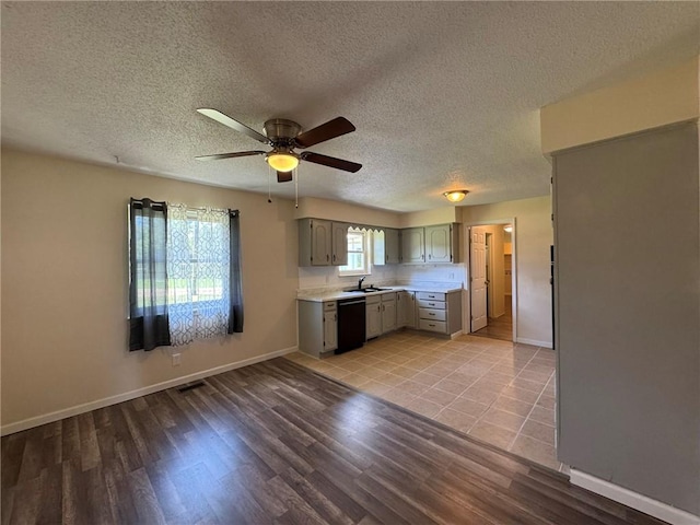811 Overlook Dr, Mountain Home, AR 72653 - kitchen featuring gray cabinetry, dishwasher, light countertops, light wood-style flooring, and a ceiling fan