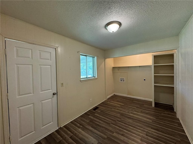 811 Overlook Dr, Mountain Home, AR 72653 - laundry area with hookup for an electric dryer, dark wood-style floors, hookup for a washing machine, and a textured ceiling