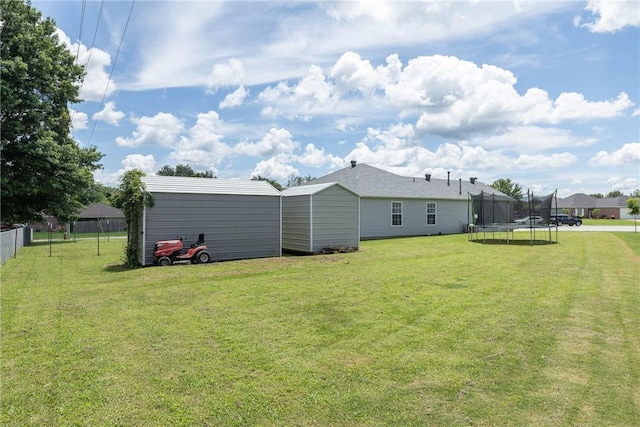 374 Meszaros Ct, Pea Ridge, AR 72751 - view of yard featuring a trampoline and an outbuilding