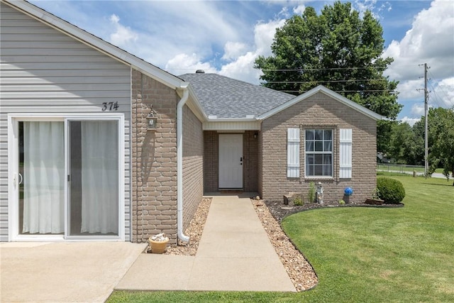 374 Meszaros Ct, Pea Ridge, AR 72751 - property entrance with a lawn, roof with shingles, and brick siding
