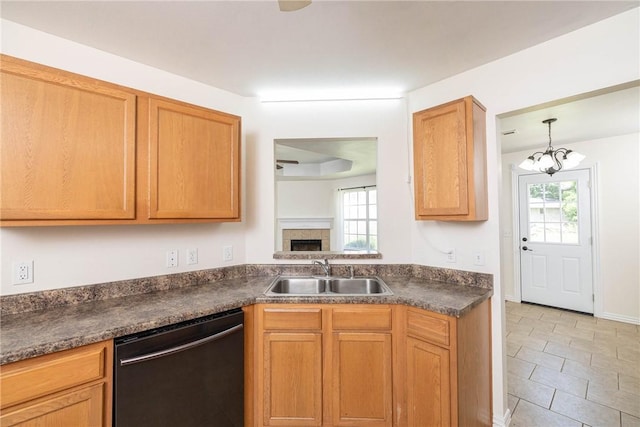 374 Meszaros Ct, Pea Ridge, AR 72751 - kitchen with dishwashing machine, dark countertops, light tile patterned flooring, a fireplace, and a chandelier