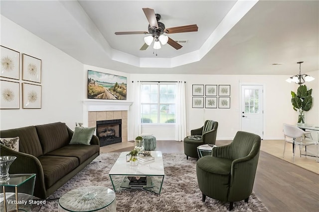 374 Meszaros Ct, Pea Ridge, AR 72751 - living area with ceiling fan, a raised ceiling, plenty of natural light, and wood finished floors