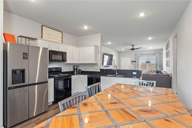 2586 Chittick St, Pea Ridge, AR 72751 - kitchen with black appliances, a peninsula, white cabinetry, open floor plan, and ceiling fan