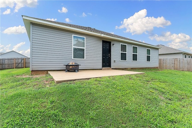 2586 Chittick St, Pea Ridge, AR 72751 - back of property featuring a patio, a fenced backyard, and a fire pit