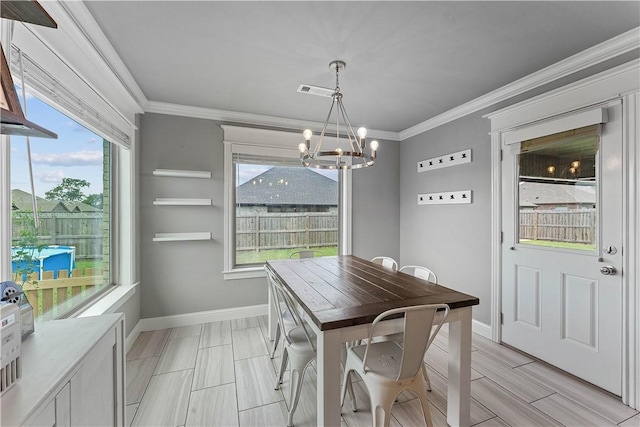1001 Kimball Ln, Pea Ridge, AR 72751 - dining area with a chandelier, plenty of natural light, and ornamental molding