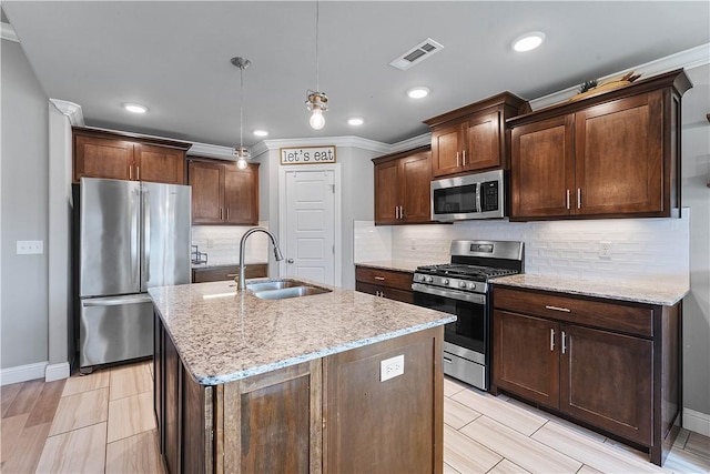 1001 Kimball Ln, Pea Ridge, AR 72751 - kitchen with appliances with stainless steel finishes, light stone counters, ornamental molding, an island with sink, and backsplash