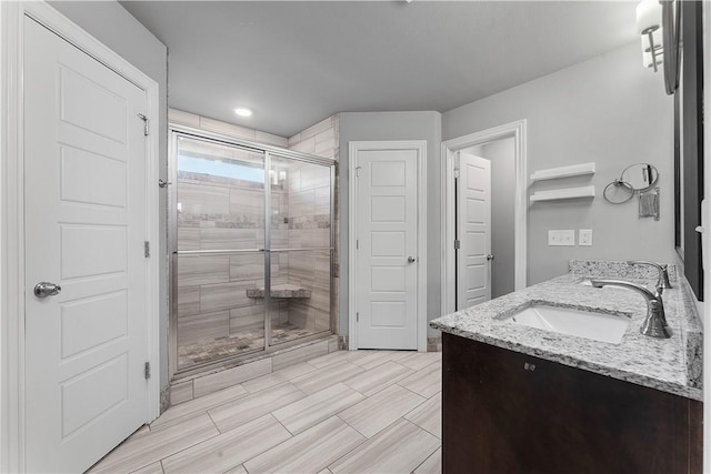 1001 Kimball Ln, Pea Ridge, AR 72751 - full bathroom featuring a stall shower, double vanity, and recessed lighting