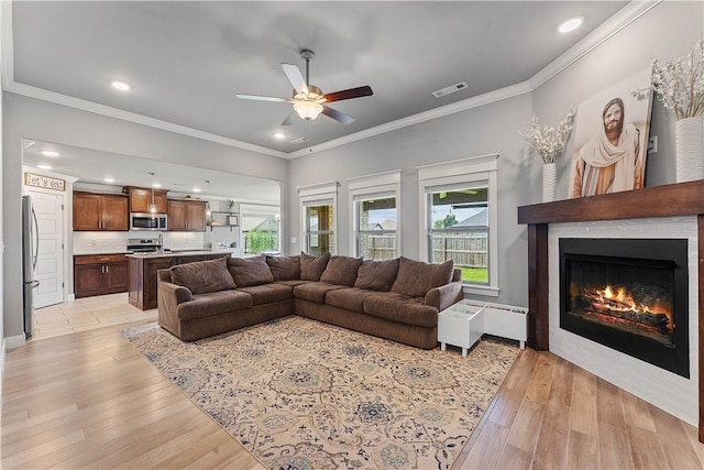 1001 Kimball Ln, Pea Ridge, AR 72751 - living room with a ceiling fan, healthy amount of natural light, light wood-style floors, recessed lighting, and ornamental molding