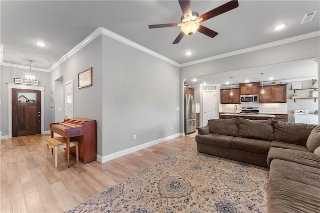 1001 Kimball Ln, Pea Ridge, AR 72751 - living area featuring independent washer and dryer, light wood-style floors, recessed lighting, a chandelier, and ceiling fan