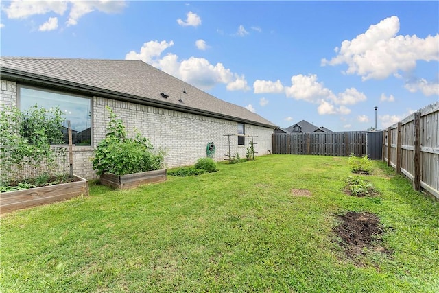 1001 Kimball Ln, Pea Ridge, AR 72751 - fenced backyard featuring a garden