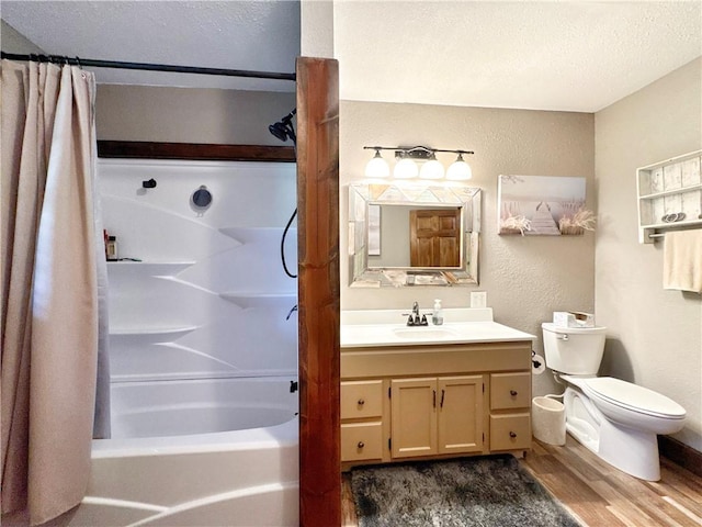 8500 Rock Creek Rd, Mulberry, AR 72947 - full bath with wood finished floors, a textured wall, shower / bath combo, and vanity