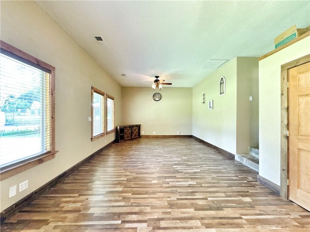 8500 Rock Creek Rd, Mulberry, AR 72947 - unfurnished room with ceiling fan and wood finished floors