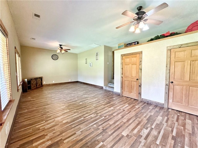 8500 Rock Creek Rd, Mulberry, AR 72947 - unfurnished living room featuring ceiling fan and wood finished floors