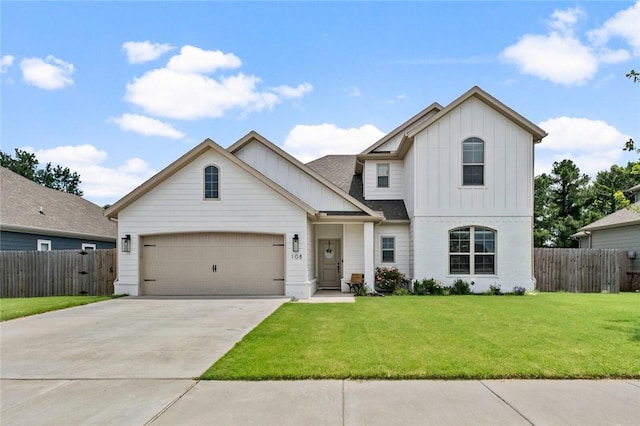 108 Dobson St, Pea Ridge, AR 72751 - view of front of home featuring board and batten siding, concrete driveway, and a garage