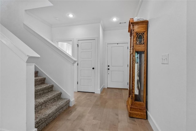 108 Dobson St, Pea Ridge, AR 72751 - foyer entrance with crown molding, stairs, light wood-type flooring, and recessed lighting