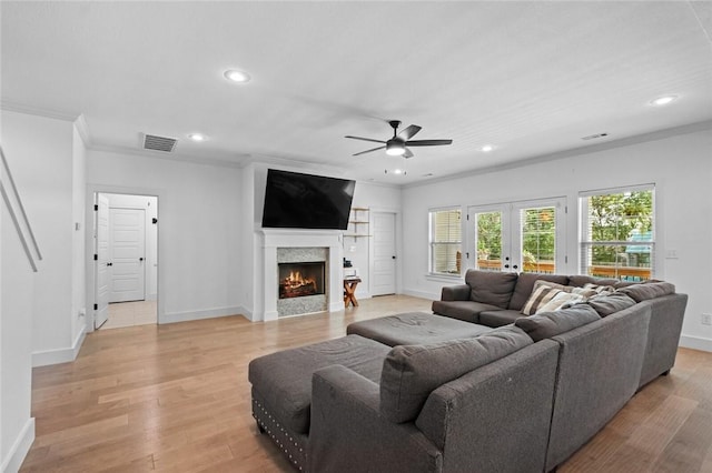 108 Dobson St, Pea Ridge, AR 72751 - living room featuring ceiling fan, ornamental molding, a lit fireplace, recessed lighting, and light wood-style flooring