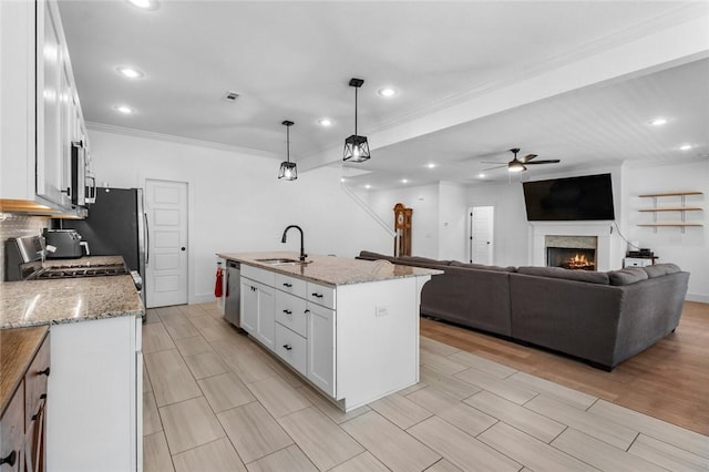 108 Dobson St, Pea Ridge, AR 72751 - kitchen with stainless steel dishwasher, a ceiling fan, white cabinetry, recessed lighting, and ornamental molding