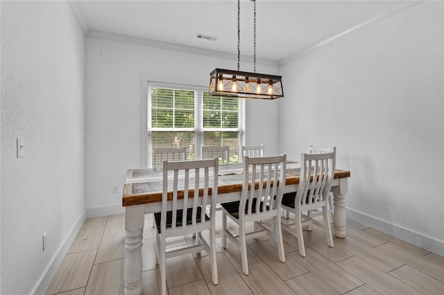 108 Dobson St, Pea Ridge, AR 72751 - dining area featuring crown molding, wood tiled floors, and a chandelier