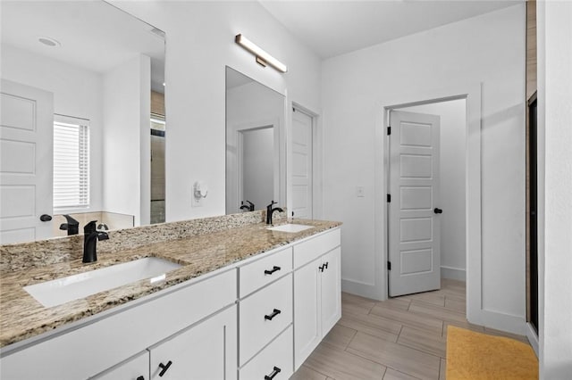 108 Dobson St, Pea Ridge, AR 72751 - full bathroom featuring double vanity and baseboards