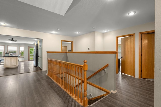 9382 Grimes Dr, Rogers, AR 72756 - hall featuring an upstairs landing, dark wood-style floors, and recessed lighting
