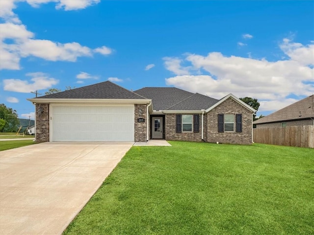 217 Idaho Ave, Farmington, AR 72730 - view of front of property with concrete driveway, a garage, brick siding, and roof with shingles