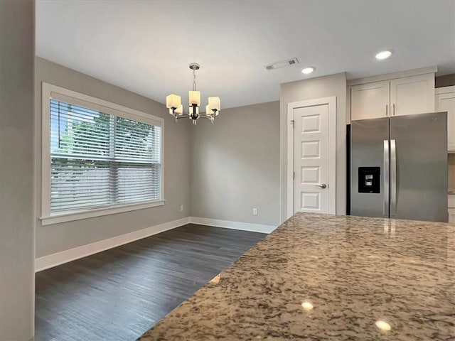 217 Idaho Ave, Farmington, AR 72730 - kitchen featuring stainless steel refrigerator with ice dispenser, a chandelier, light stone countertops, dark wood finished floors, and pendant lighting