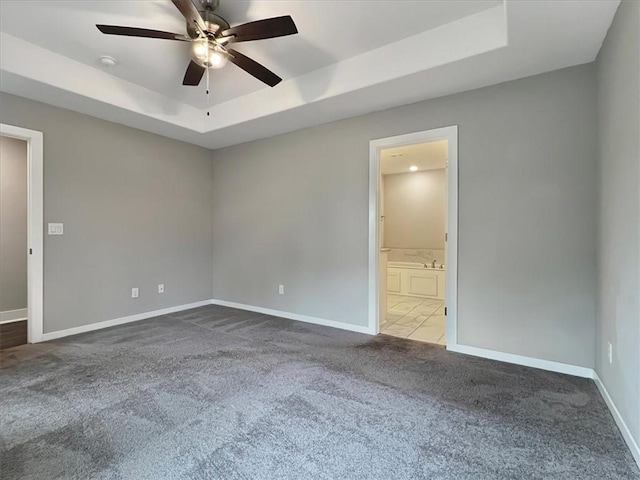 217 Idaho Ave, Farmington, AR 72730 - unfurnished room with a tray ceiling, dark colored carpet, ceiling fan, and a smoke detector