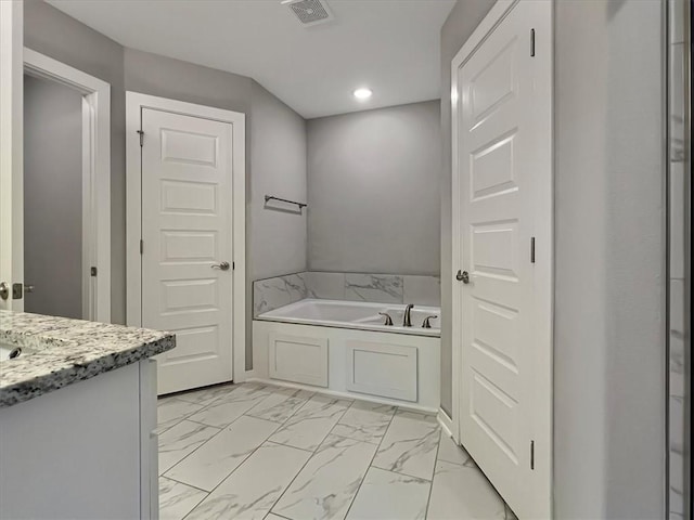 217 Idaho Ave, Farmington, AR 72730 - full bath featuring a bath, recessed lighting, marble look tiles, and vanity