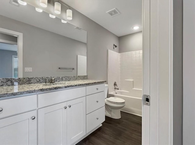 217 Idaho Ave, Farmington, AR 72730 - full bathroom with vanity, wood finished floors, and washtub / shower combination