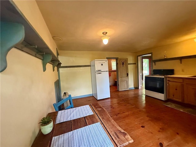 16 Nut St, Eureka Springs, AR 72632 - kitchen with white appliances, wood finished floors, and open shelves