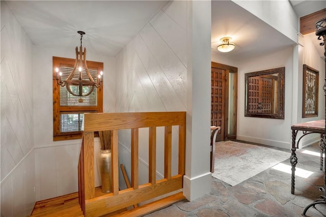 1018 N Canterbury Rd, Fayetteville, AR 72701 - staircase with a chandelier and stone finish floors